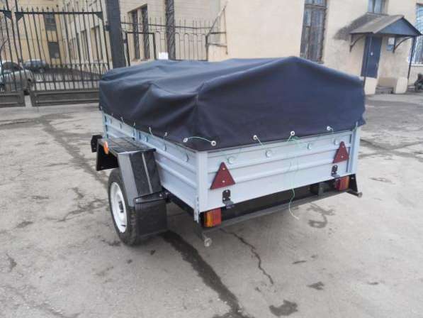 Прицеп для легкового автомобиля с V образным дышлом 1800х1250 с тентом и дугами в Москве фото 11